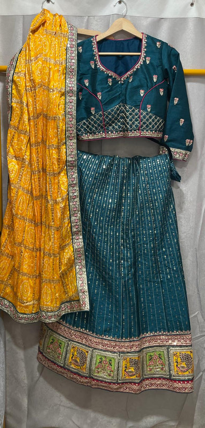 Blue silk sequence peacock motif lehenga with yellow bandani dupatta