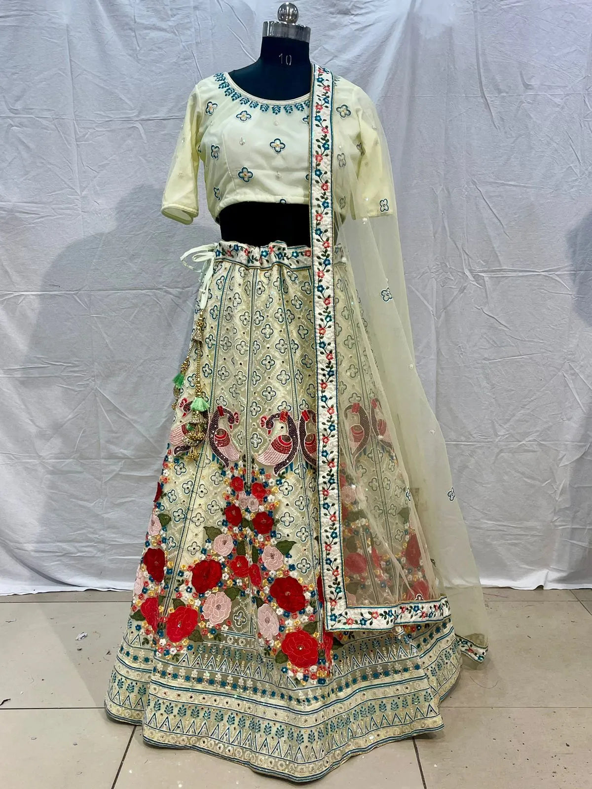 yellow peacock embroidery net mirror designer lehenga